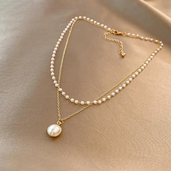 Elegant perlesmykke i guld