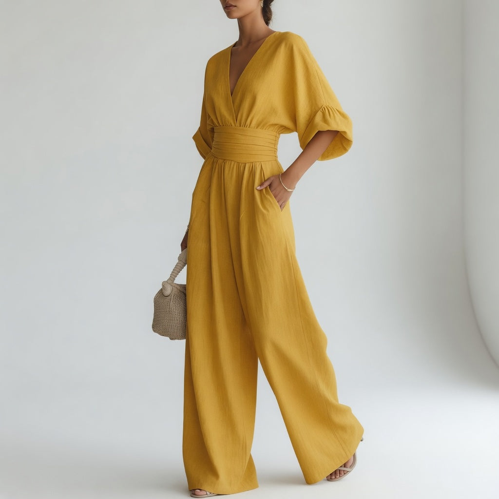 Blandine™ – Vid jumpsuit med V-hals og naturlig flydende elegance